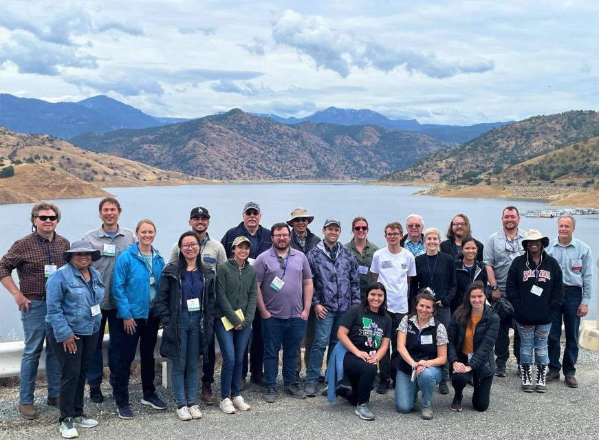 Photo of tour participants standing on top of Terminus Dam near Visalia