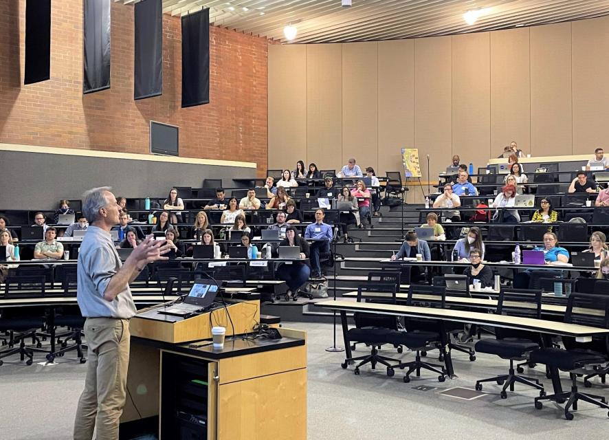 Image shows a speaker addressing the Water 101 Workshop.