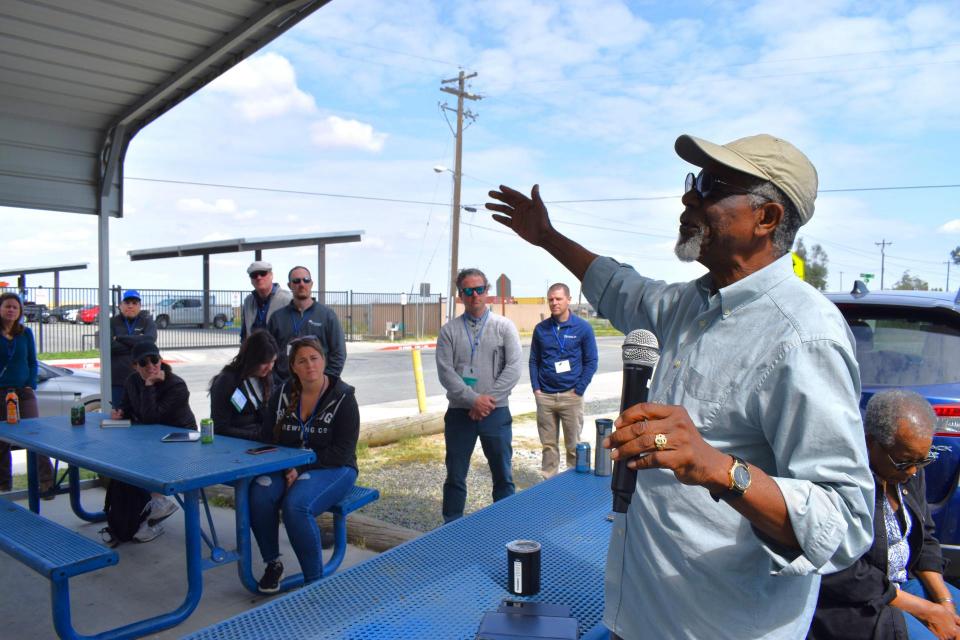 Image shows a speaker addressing participants on our Central Valley Tour.